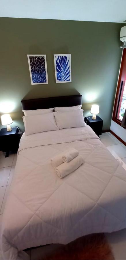 Bliss Hoteis Centro Búzios Kültér fotó A bed with a duvet